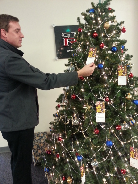 Matt picks the perfect tag from the Angel Tree.
